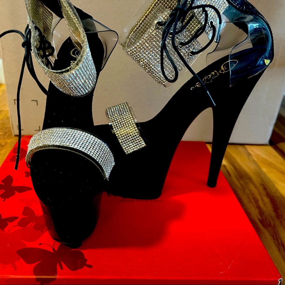 Black and rhinestone pleaser heels. Size 8. Never worn
